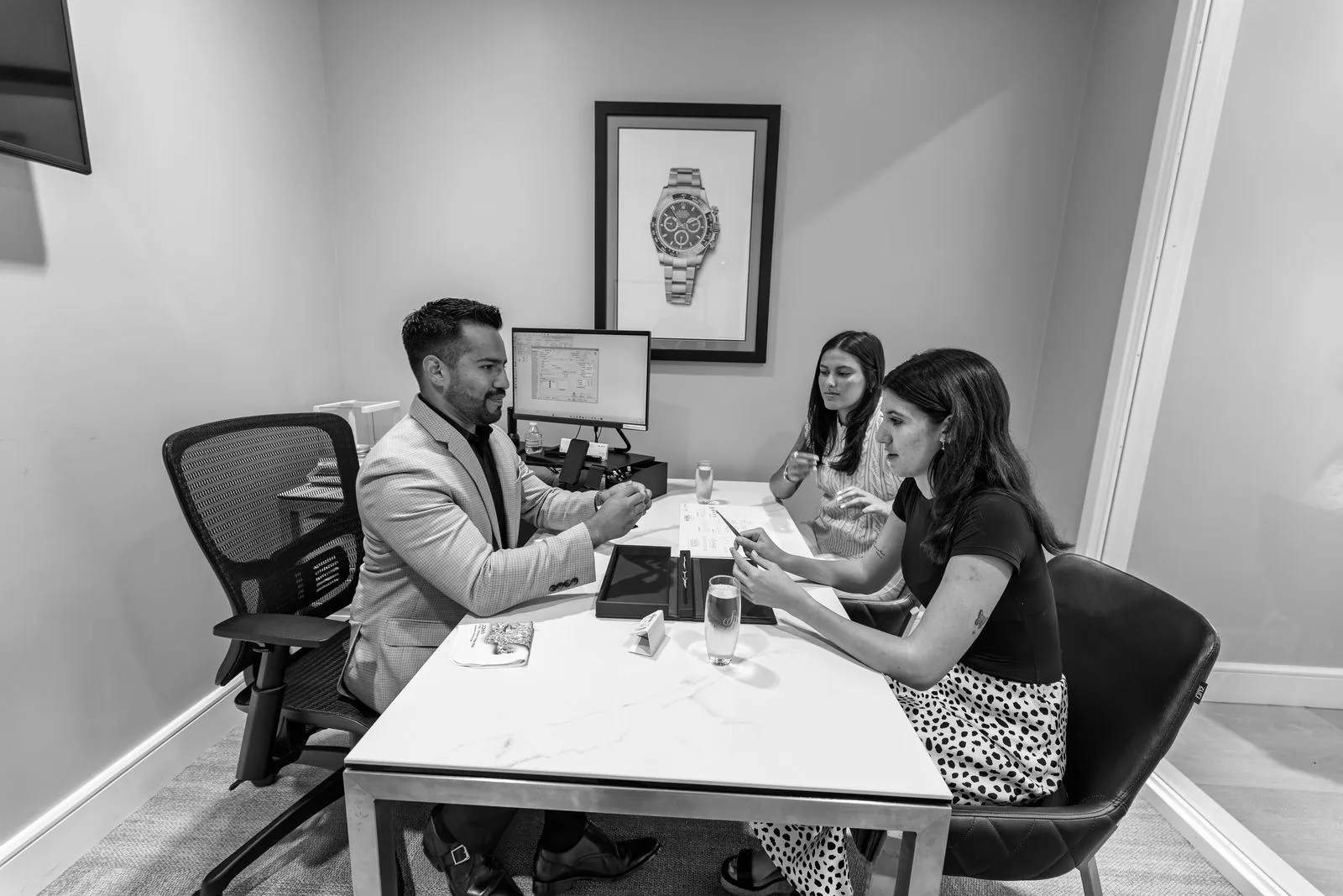 A Solomon Brothers associate walking clients through options at the consultation table