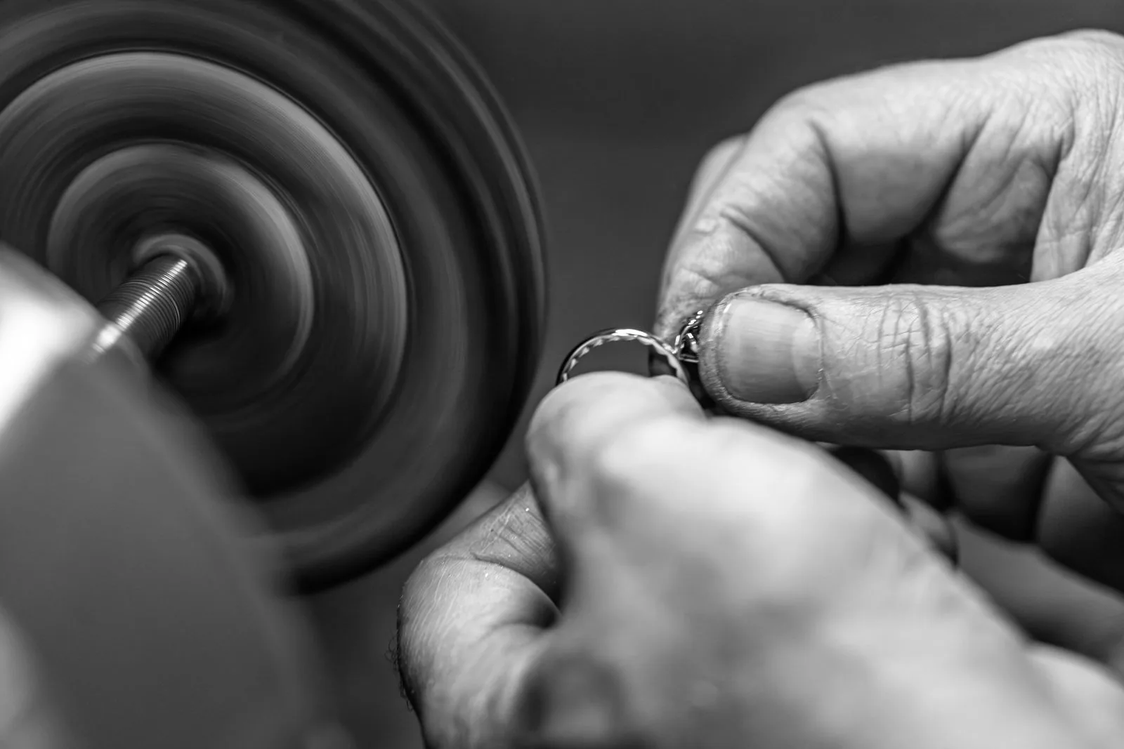 A ring held to a spinning polishing wheel