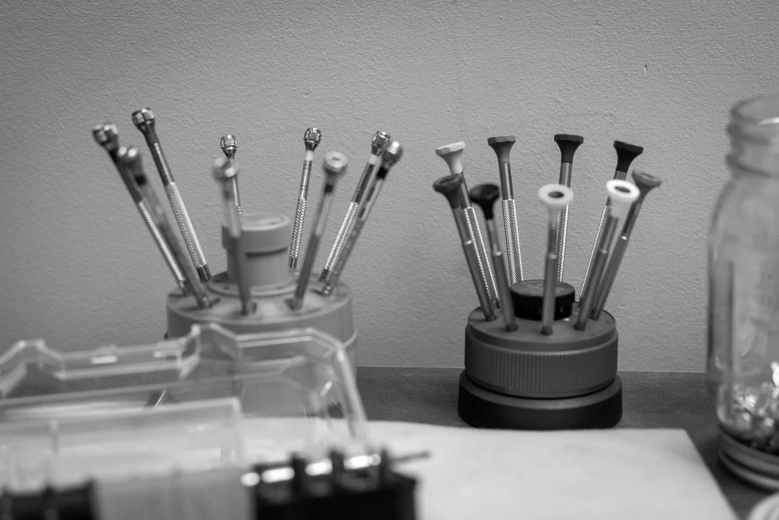 A jeweler's gravers and hand tools arranged at the bench
