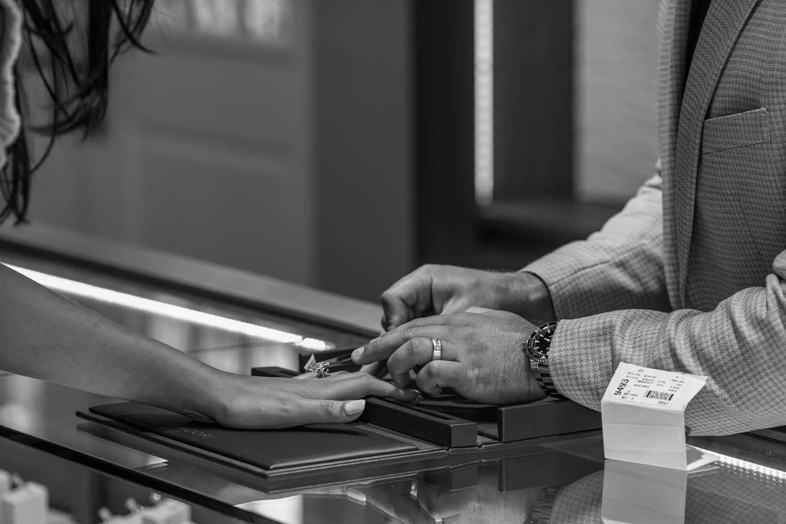 Jewelry presented on a tray to a client at the display case